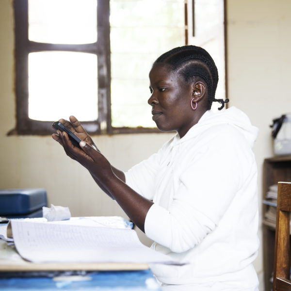 Tanzania nurse, checking up on medicine